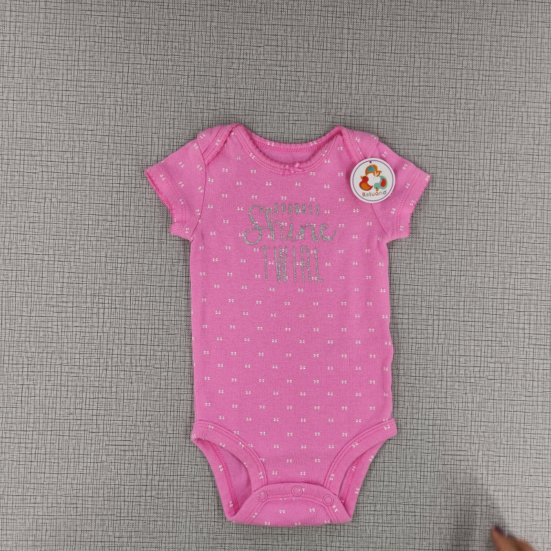 Body rosado con estampado de moñitos "SPARKLE Shine TWIRL"