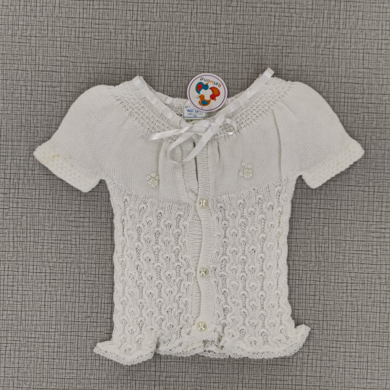 Camisa blanca tejida con listón en el cuello